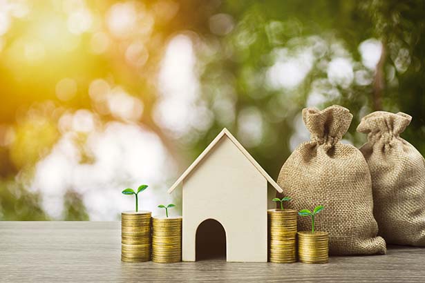 model home with coins and money bags